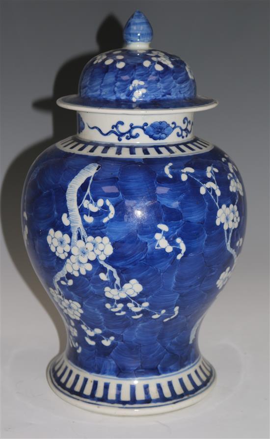 A Chinese blue and white prunus pattern vase and cover, Kangxi mark, 47cms (a.f.)